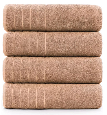Spa-like experience with a white 600-GSM bath sheet and candles